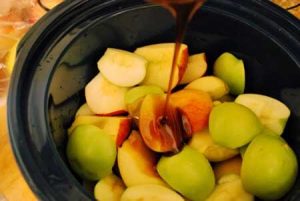 Step three for making this Homemade Apple Butter is to add the molasses and honey.