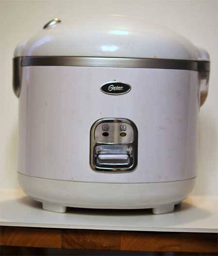 A rice cooker sits waiting to be used for this sticky brown rice recipe.