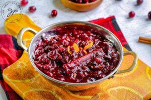 Step severn is to transfer the Homemade Cranberry Sauce to a serving dish.
