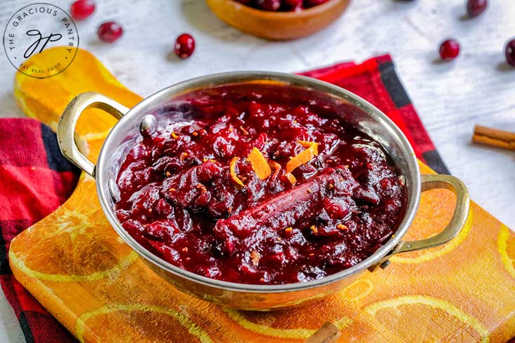 A silver serving dish filled with homemade cranberry sauce.