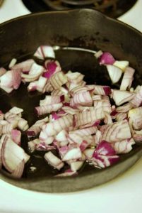 Sautéing the onions for this Clean Eating Bubble And Squeak Recipe