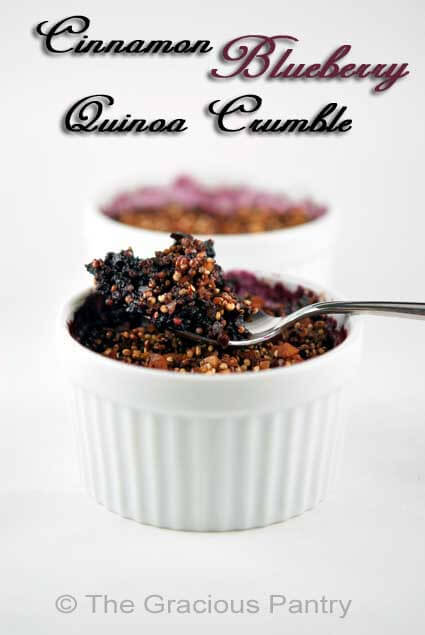 Two white ramekins are lined up and filled with blueberry quinoa crumble.