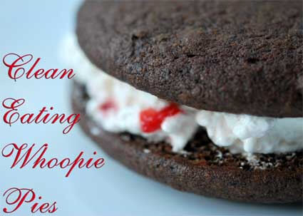 A side view of a whoopie pie filled with white filling sits on a blue/gray background in this Clean Eating Desserts Cookbook.