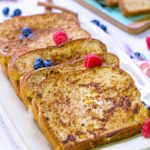 Four slices of Healthy French Toast are laid out on a serving platter, ready to eat.