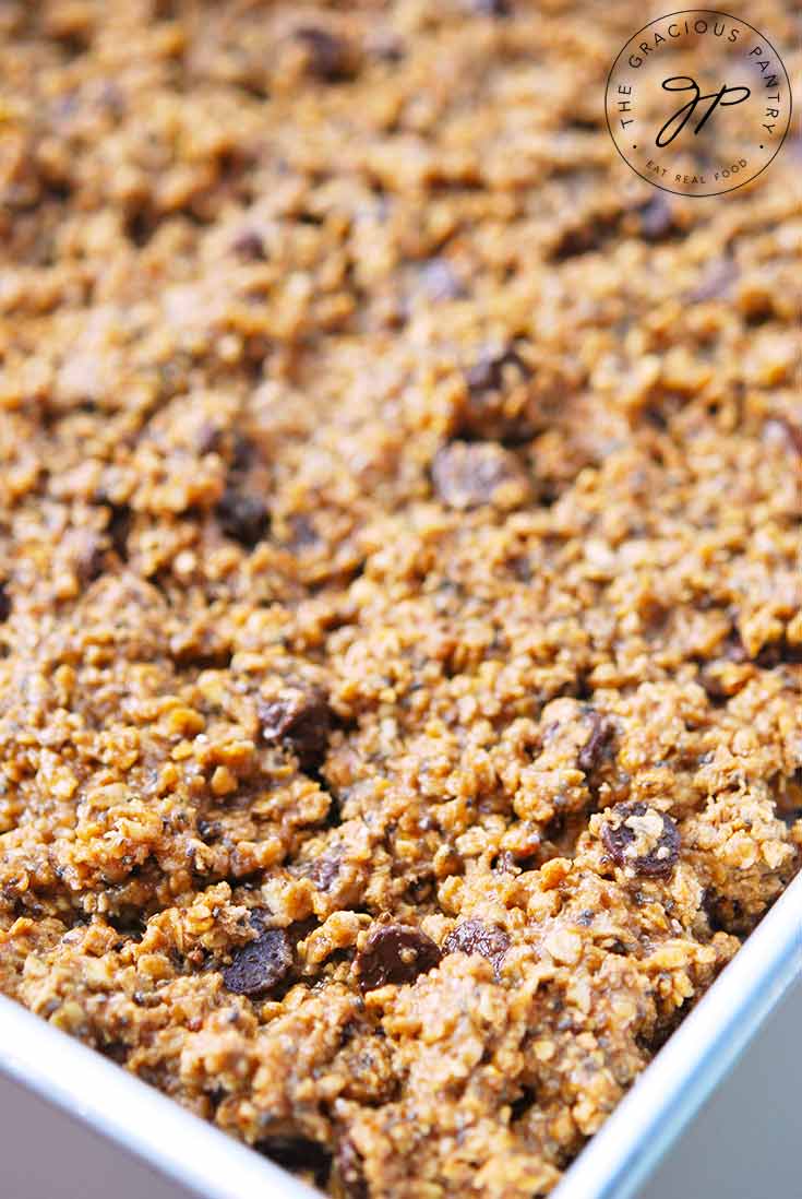 A tray filled with Chocolate Chip Protein Bar batter sits ready to go into the oven for baking.