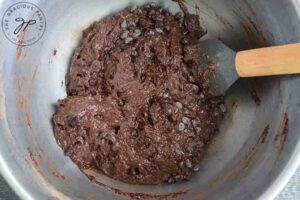 Adding the wet ingredients along with the chocolate chips in this Healthy Brownies Recipe.