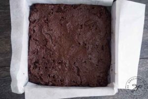 The batter for this Healthy Brownies Recipe spread evenly over the pan.