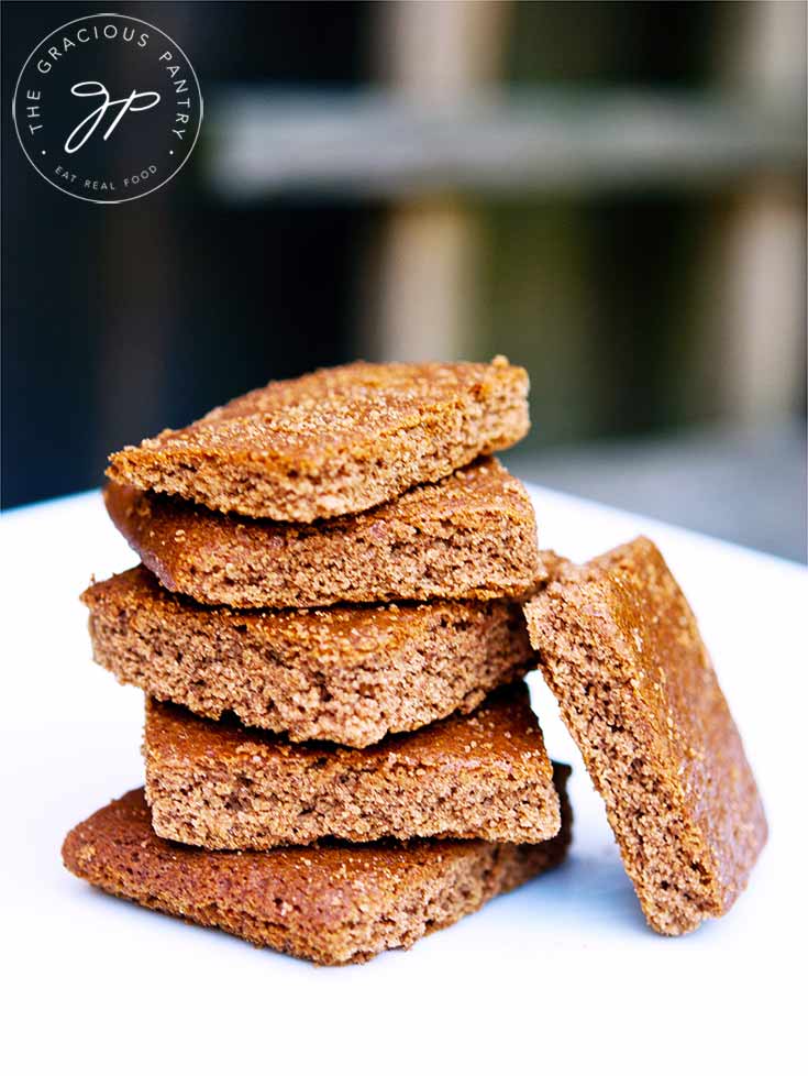 A stack of these Graham Cracker Cookies sit on a white platter, ready to eat.