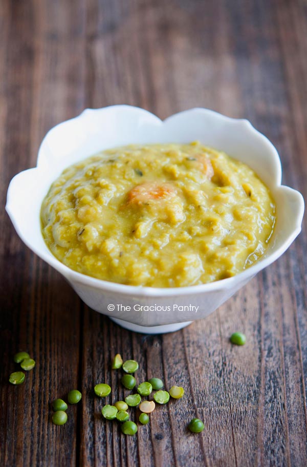 A white bowl filled with Split Pea Soup.