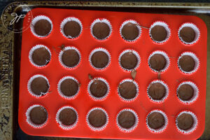 First layer of chocolate in muffin papers.