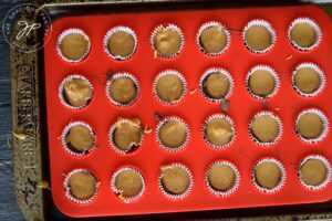 Peanut butter over frozen chocolate.