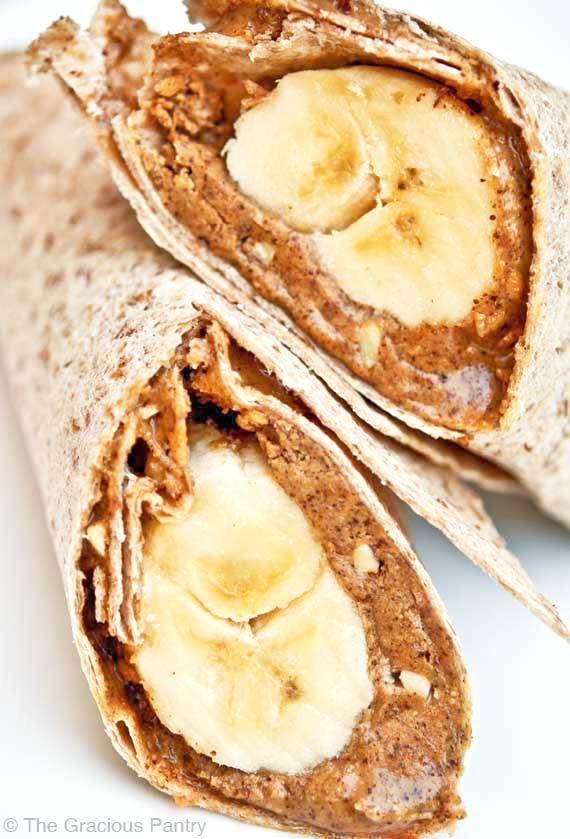 A banana wrap, cut in half and stacked on a white background.