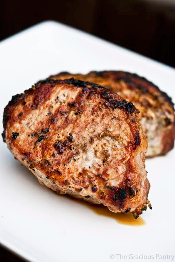 Thow Grilled Pork Chops from this Grilled Pork Chops Recipe sit on a serving platter, ready to enjoy