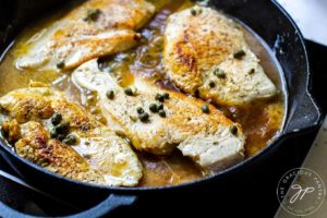 Step five shows the capers added to the skillet, sprinkled over the chicken.