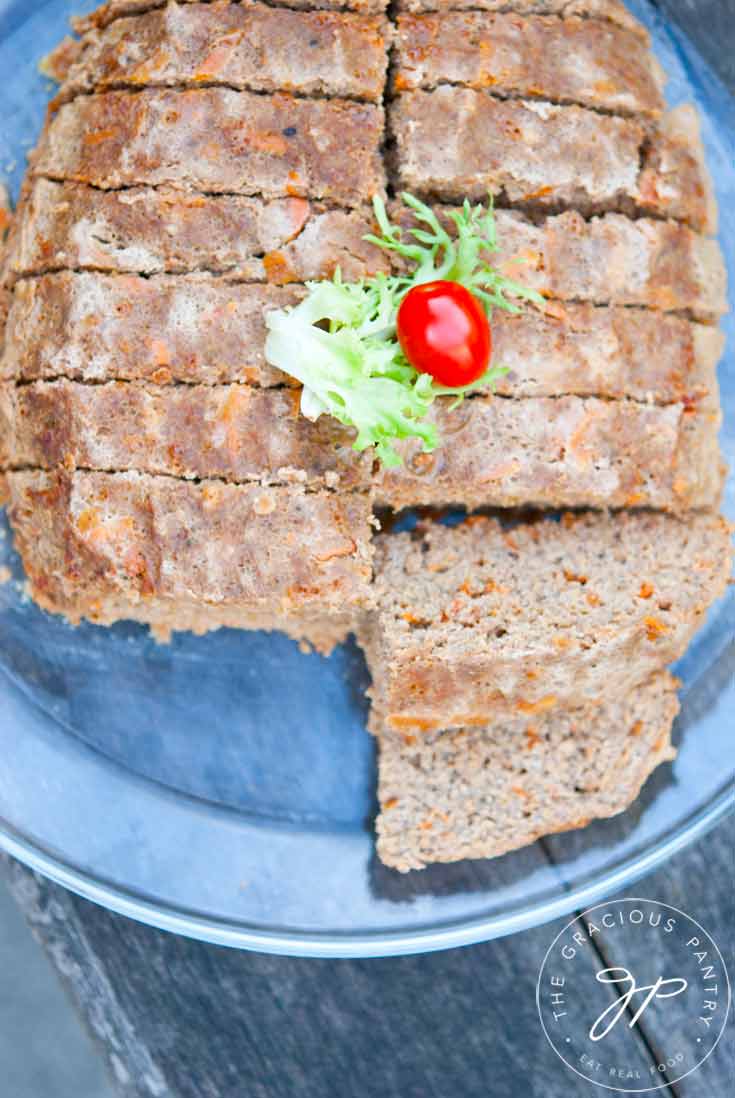 Clean Eating Slow Cooker Meatloaf shown from overhead, looking down onto the platter. It's sliced into chunky slices and is ready to serve.