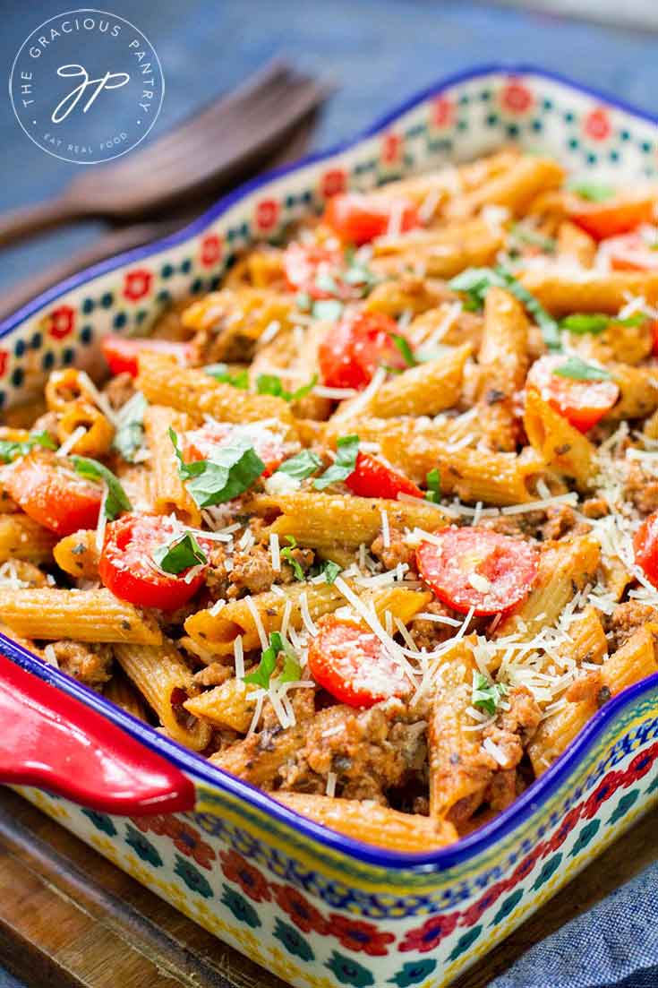 Baked Italian Ziti Recipe, finished baking, topped with fresh, cherry tomatoes, and ready to serve.