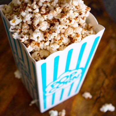 Kettle corn in a popcorn bucket, ready to eat.