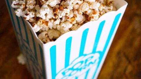 Kettle corn in a popcorn bucket, ready to eat.
