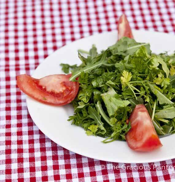 This healthy Mesclun salad recipe makes an easy lunch or light dinner salad. Make our recipe for delicious balsamic cashew dressing to drizzle over the top! bowl of healthy Mesclun Salad with tomatoes