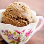 A scoop of Dairy Free Chocolate Ice Cream served in a decorative tea cup.