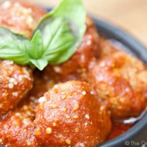 Slow Cooker Italian Style Meatballs in a black bowl.