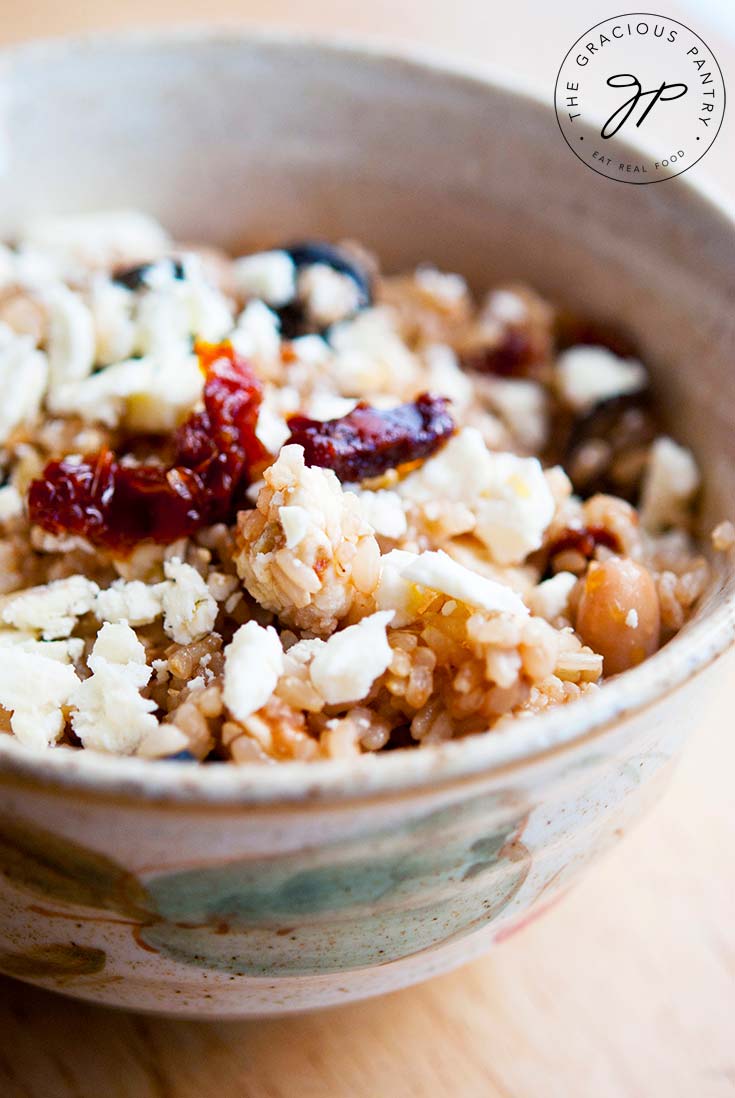 A single Greek Rice Bowl sits ready to eat.