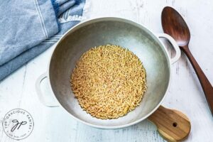 Roasting the whole grain orzo.