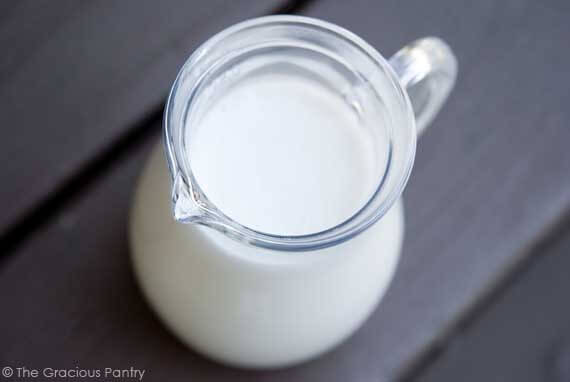 A glass pitcher of milk.