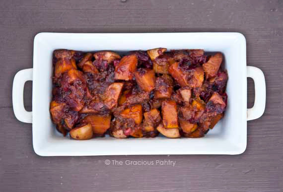 Holiday Butternut Cranberry Bake in a white casserole dish.