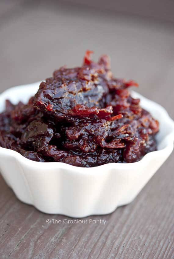 Crock Pot Cranberry Sauce in a white bowl, ready to serve.