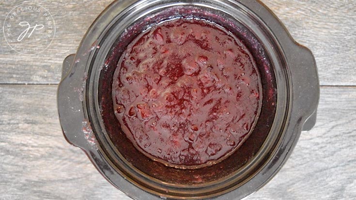 Cooking the crock pot cranberry sauce without the lid on to thicken it.