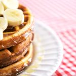 A stack of Saturday Morning Waffles on a white plate.