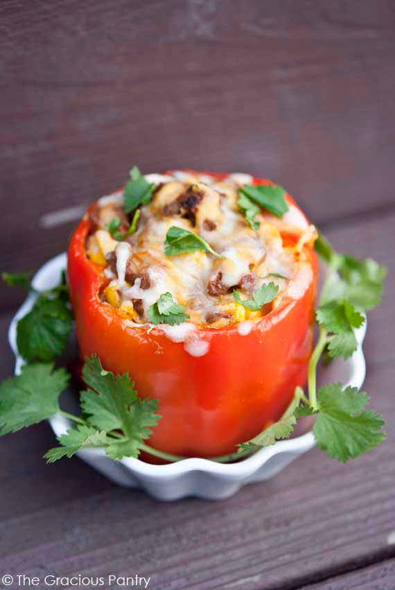 Mexican stuffed peppers are easy to make and kids love this meal! This healthy stuffed peppers recipe uses clean ingredients and it's perfect for meal prep. Mexican healthy stuffed peppers