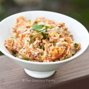 A white dish sitting on a ledge, filled with Italian Breakfast Scramble.