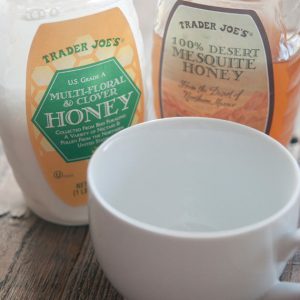 Honey Milk in a honey jar with a second jar of honey next to it.