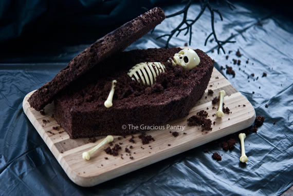 Chocolate Coffin Bread Coffin displayed on a cutting board with a skeleton inside the coffin.
