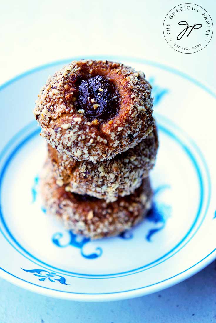 A stack of these thumbprint cookies sit in a decorative bowl.