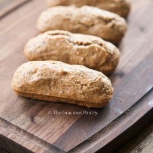 A row of Low Carb Snack Bars sit lined up on a cutting board.