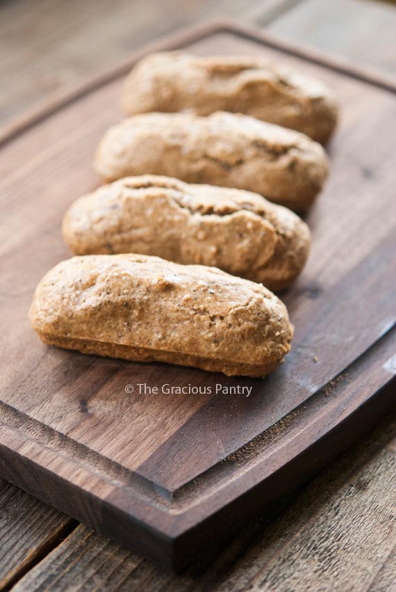 A single row of low carb snack bars lined up on a cutting board.