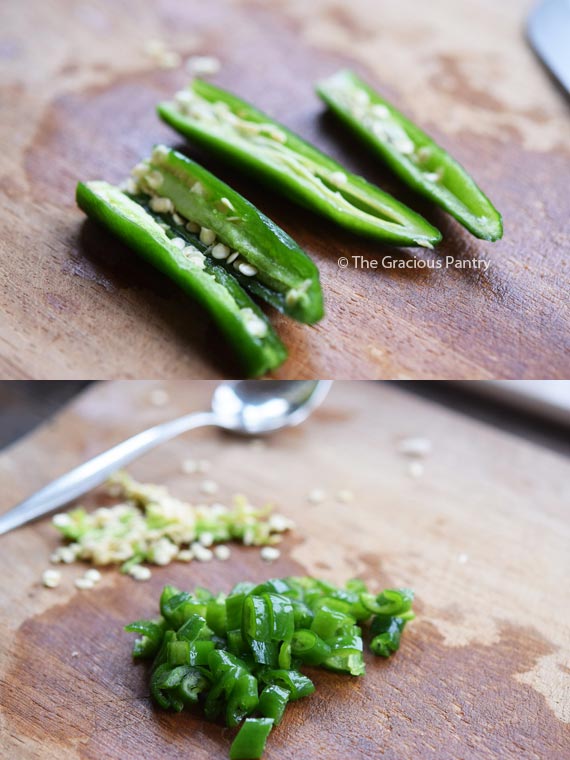 Chopped peppers lay on a cutting board.