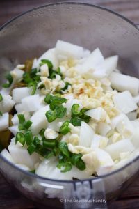 Salsa Verde ingredients in a food processor.