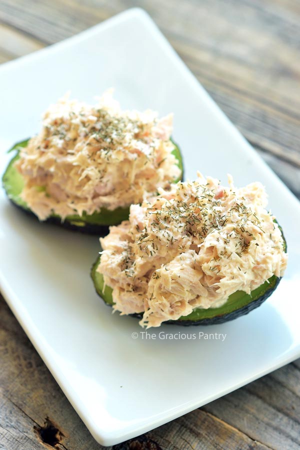 Photo showing a Tuna Stuffed Avocado. The avocado is cut in half and stuffed with tuna salad.