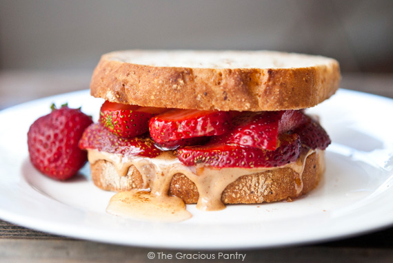 A Strawberry Sandwich sitting on a white plate.