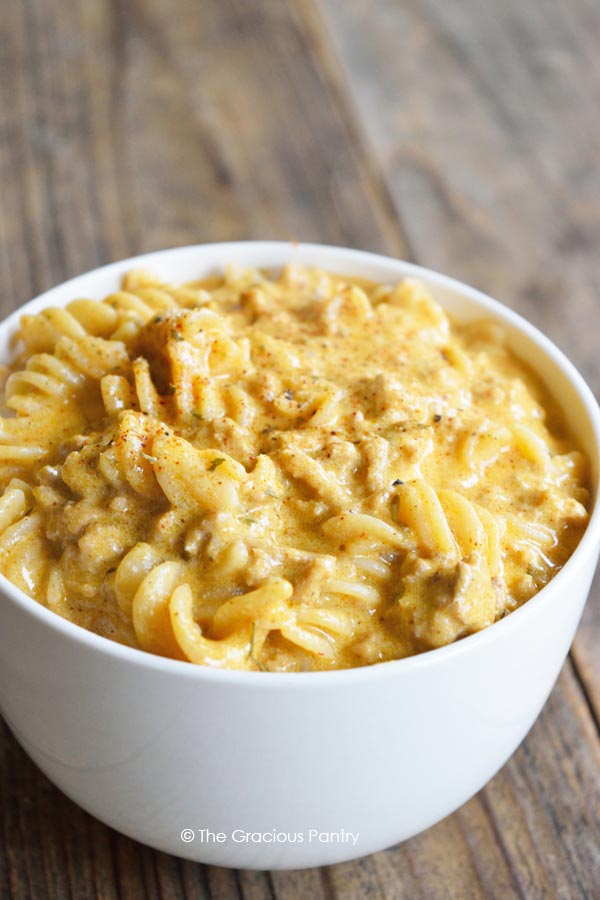Homemade Hamburger Helper Cheeseburger Pasta is made with real food ingredients! If you love the classic boxed mix, you'll flip for this healthier recipe. Real food ingredient homemade Cheeseburger Pasta in a white bowl