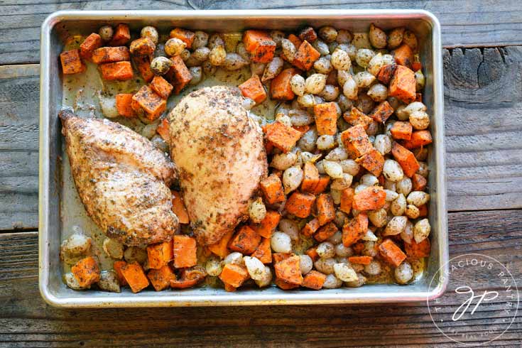 Clean Eating Chicken And Sweet Potatoes Sheet Pan Dinner on the sheet pan they were cooked on.