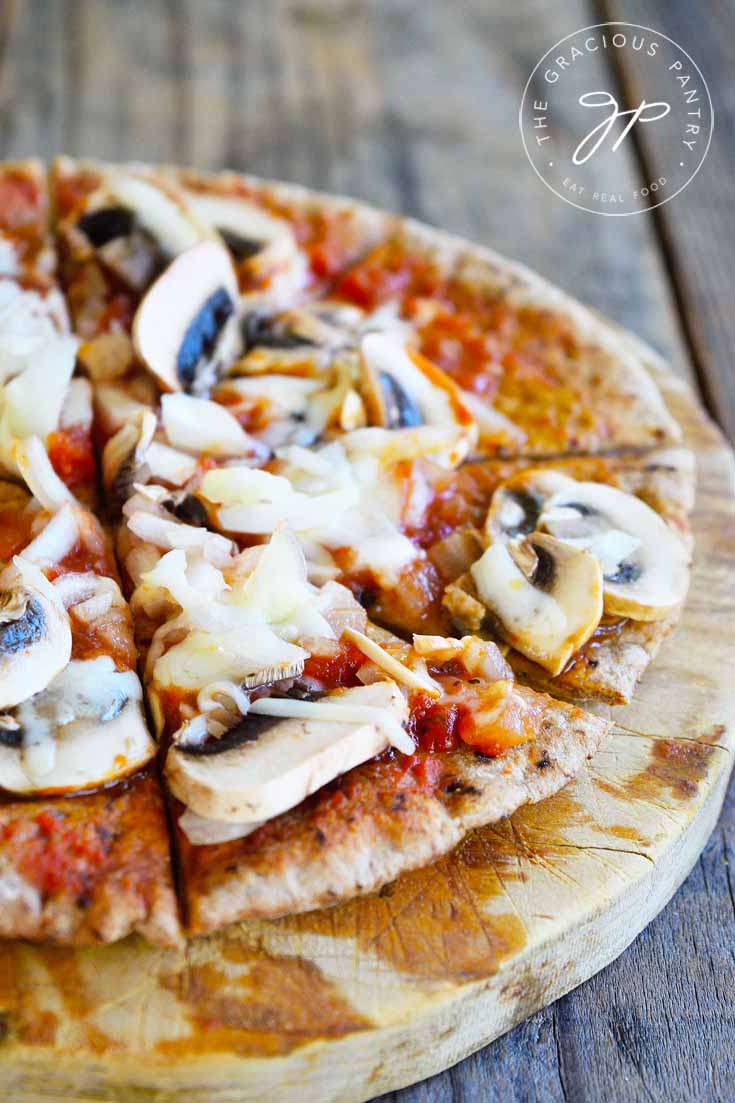 Mushroom Pita Pizza With Onion And Swiss Cheese