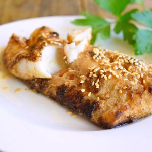 Chinese-Style Sheet Pan Cod on a white plate.