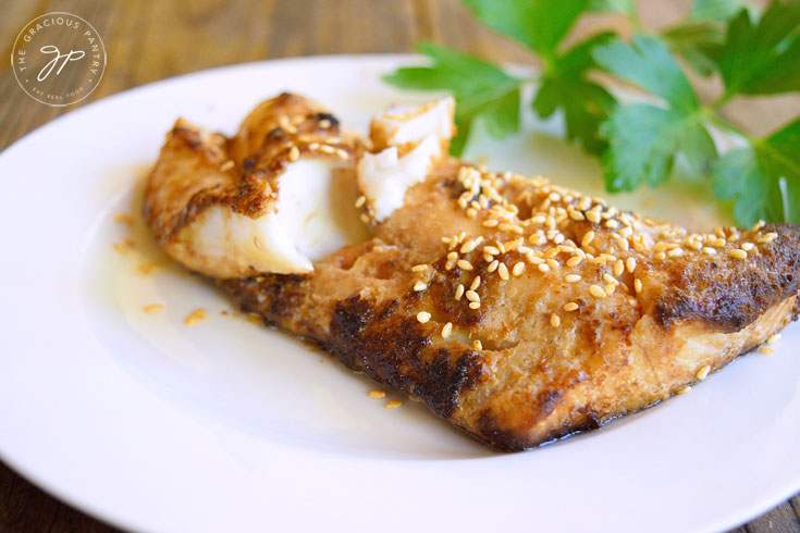 Chinese-Style Sheet Pan Cod on a white plate.