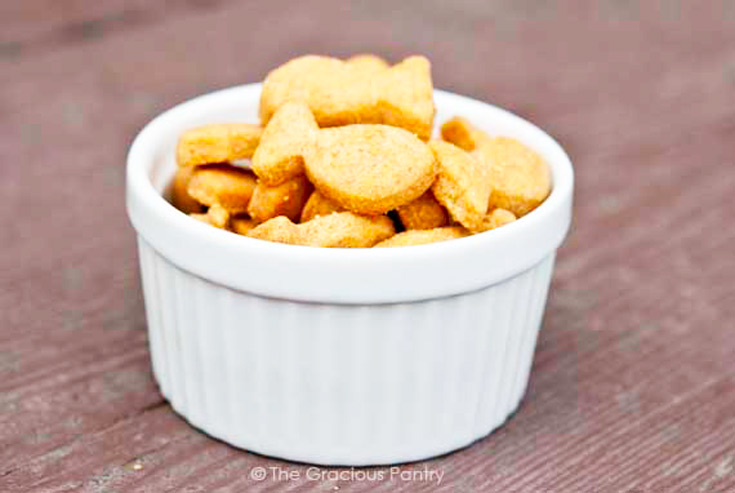 A white bowl filled with goldfish crackers.