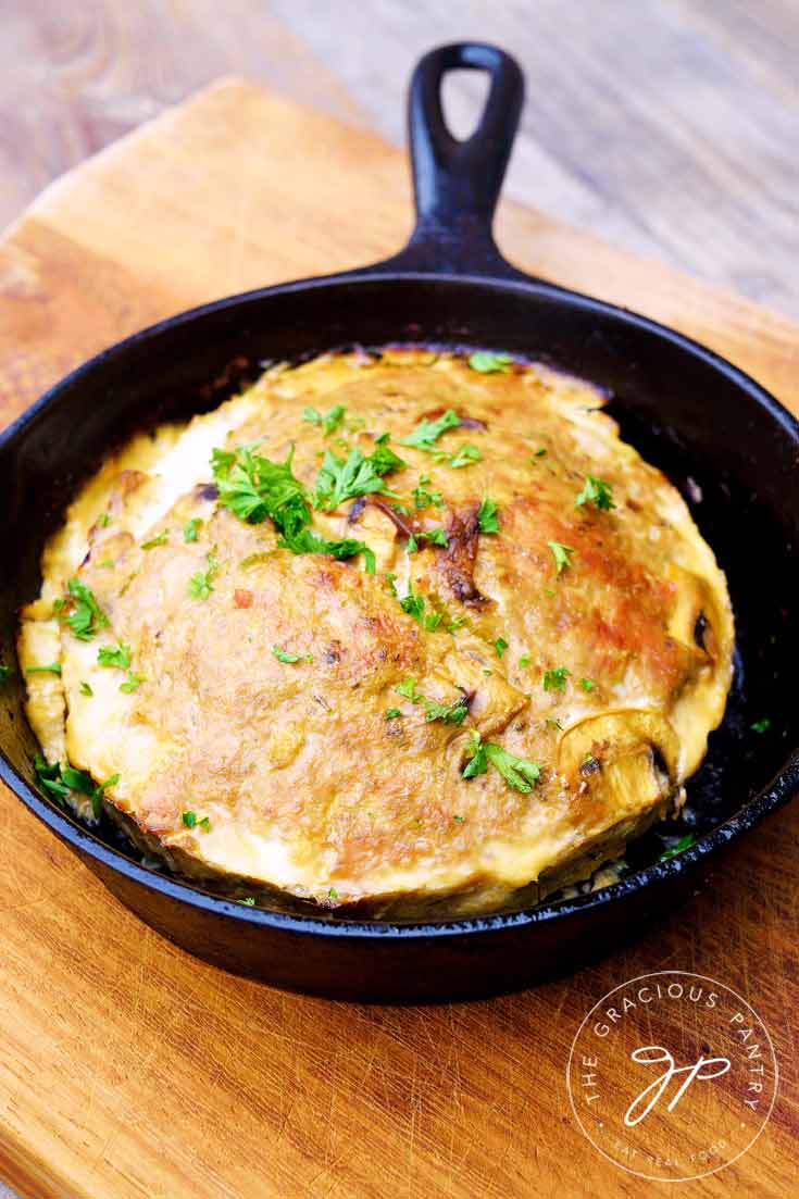 Clean Eating Skillet Meatloaf shown uncut in the skillet it was cooked in.